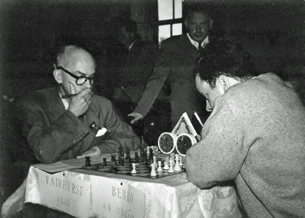 Dublin Zonal: IM William Fairhurst, SCO, left, GM Pal Benko, HUN (later USA), right, and with hand on chair, IM Arthur Dunkelblum, BEL (photo Joe Keenan)