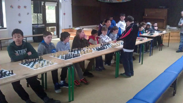 Padraig Hughes (12) giving a simultaneous display against Curragh Junior Chess Club