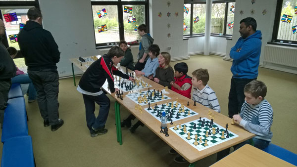 Padraig Hughes (12) giving a simultaneous display against Curragh Junior Chess Club